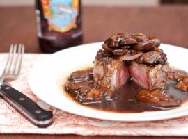 Delicious steak with mushrooms-beer sauce.